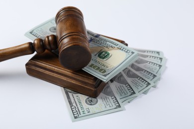 Judge's gavel and money on white background