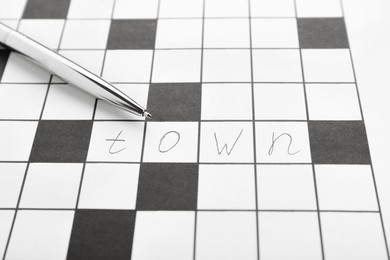 Photo of Crossword with answer and pen, closeup view