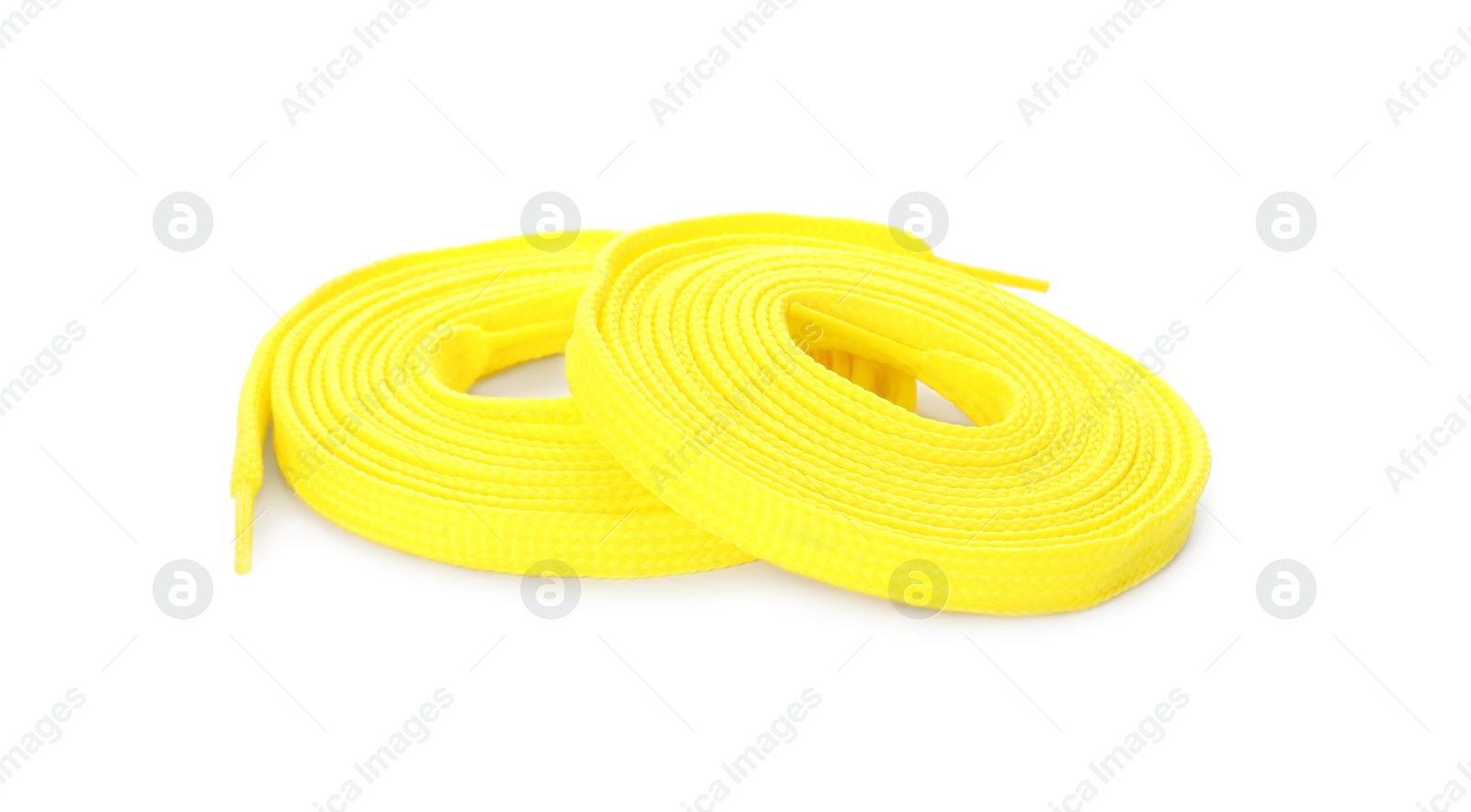 Photo of Yellow shoe laces isolated on white. Stylish accessory