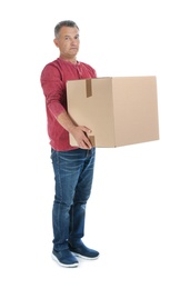 Photo of Full length portrait of mature man carrying carton box on white background. Posture concept