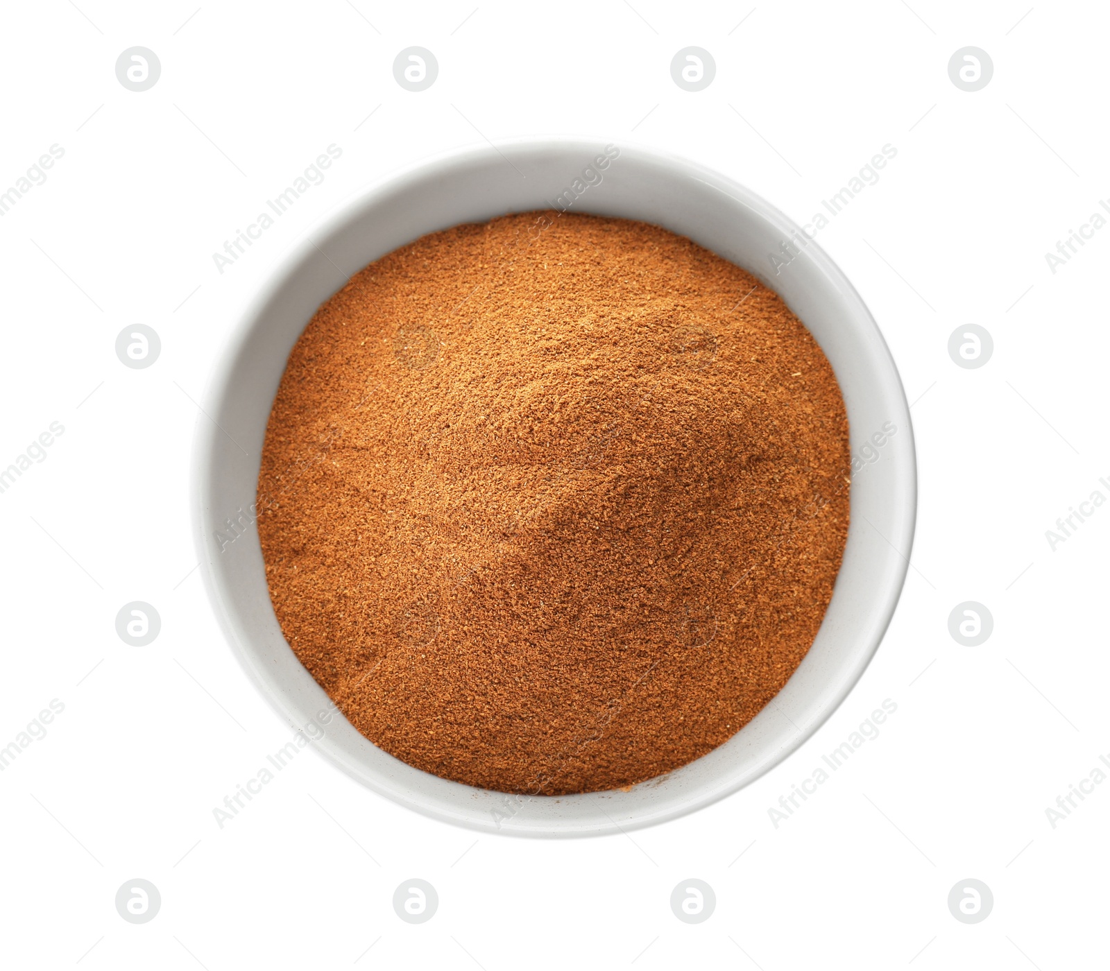 Photo of Bowl with aromatic cinnamon powder on white background