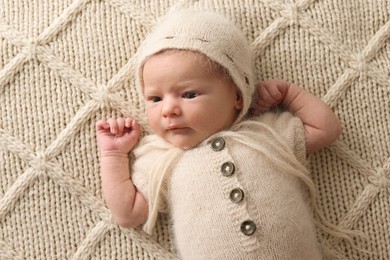 Adorable little baby lying on blanket, top view