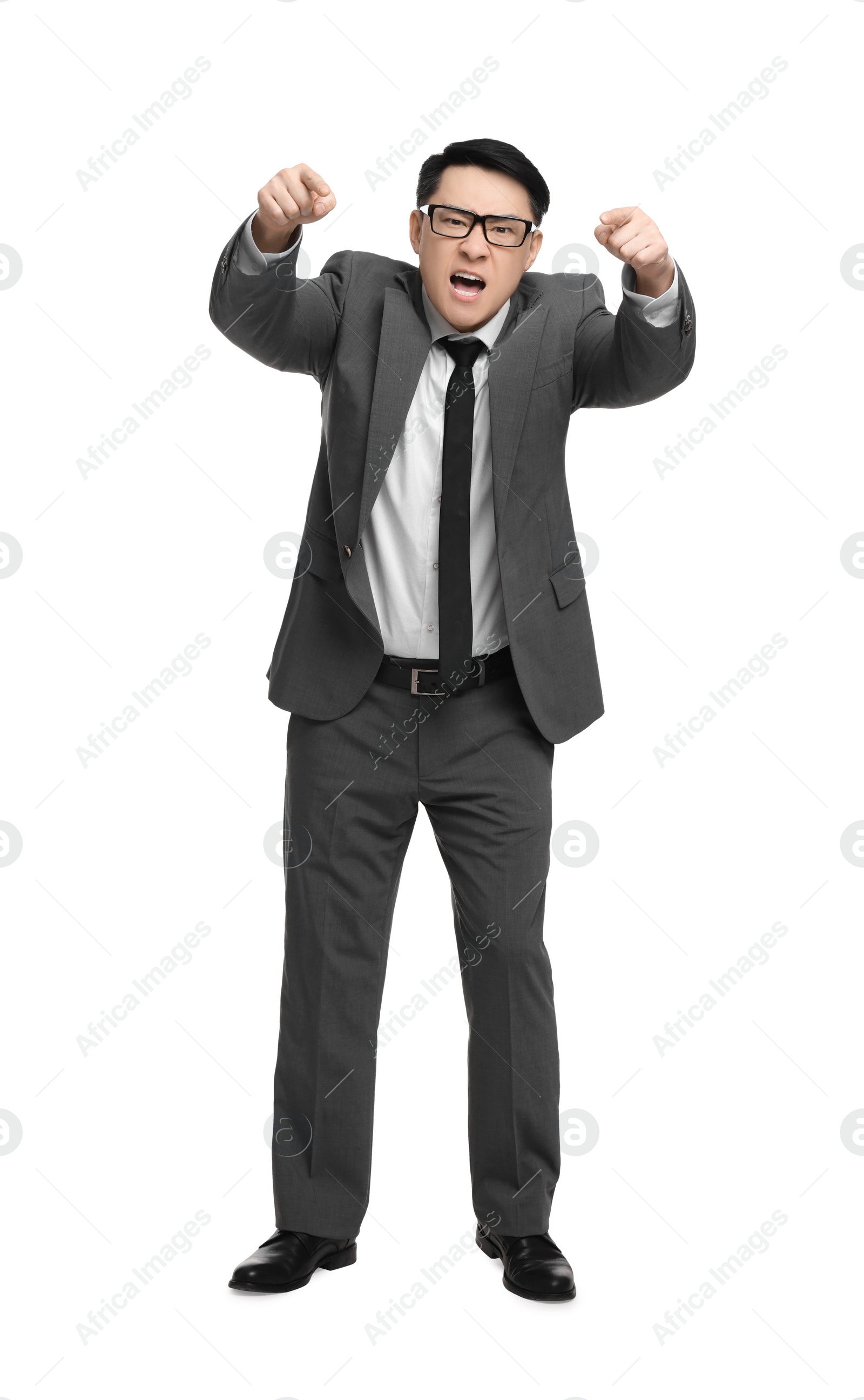 Photo of Angry businessman in suit screaming on white background