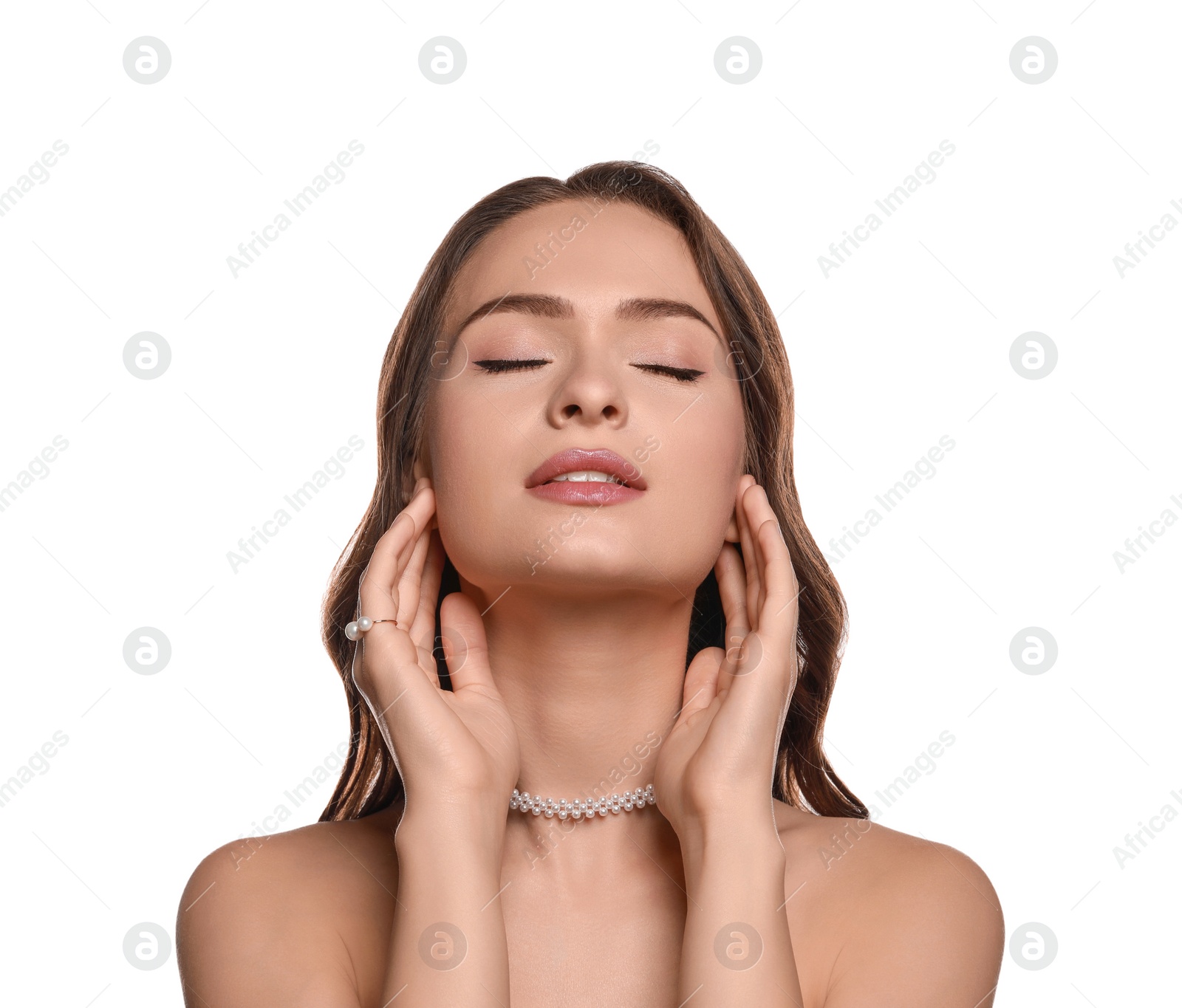 Photo of Young woman wearing elegant pearl jewelry on white background