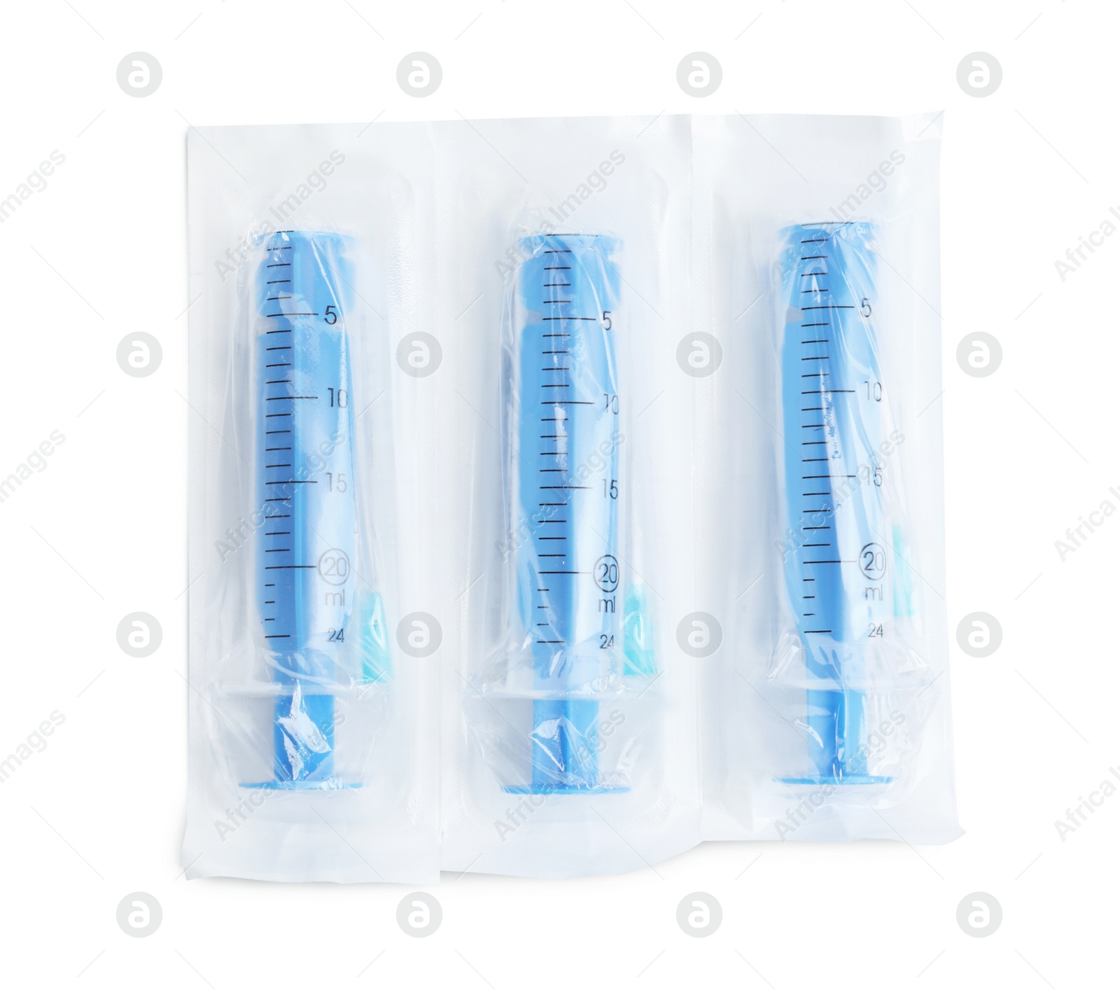 Photo of Packed disposable syringes with needles on white background, top view