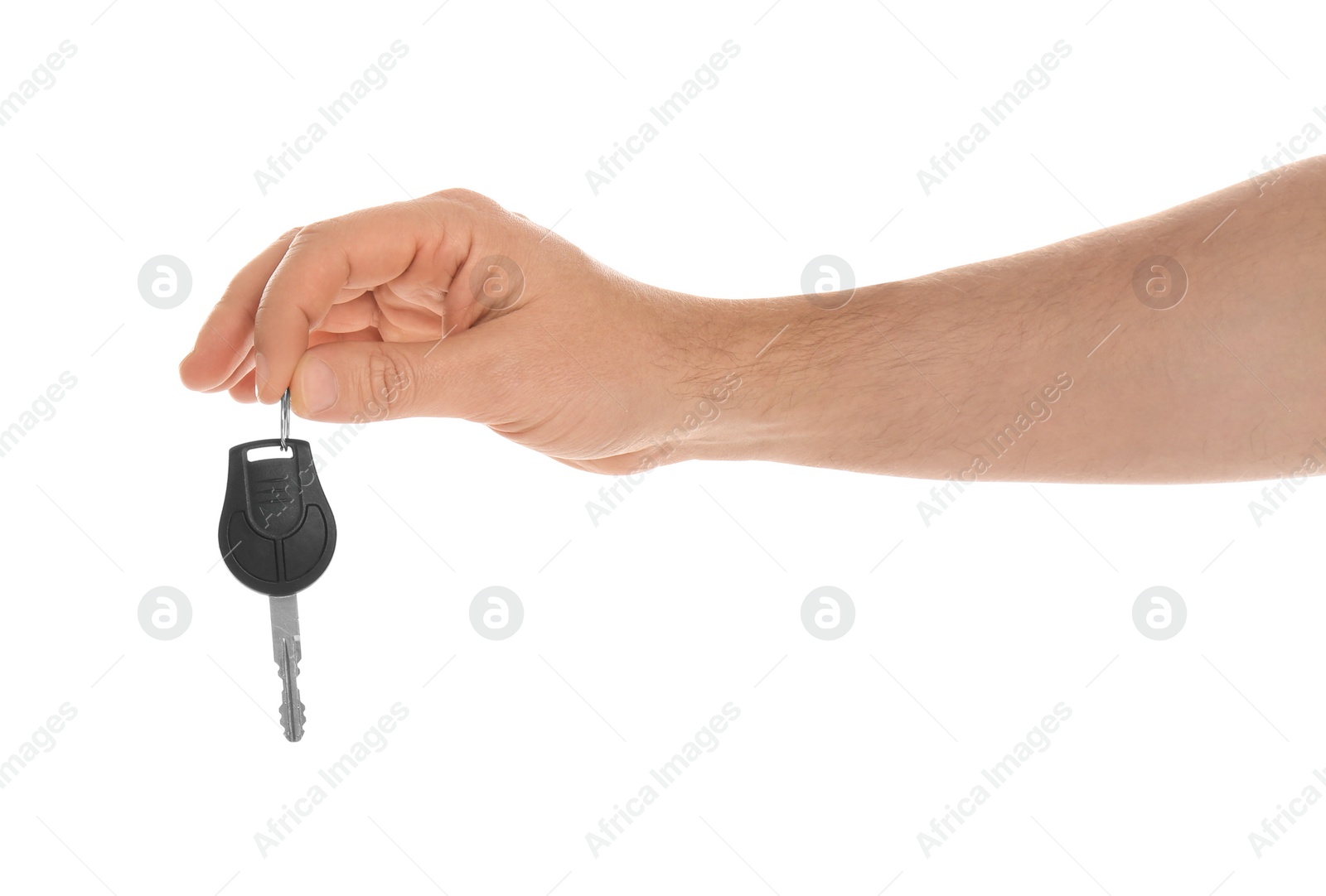 Photo of Man holding key on white background, closeup. Car buying