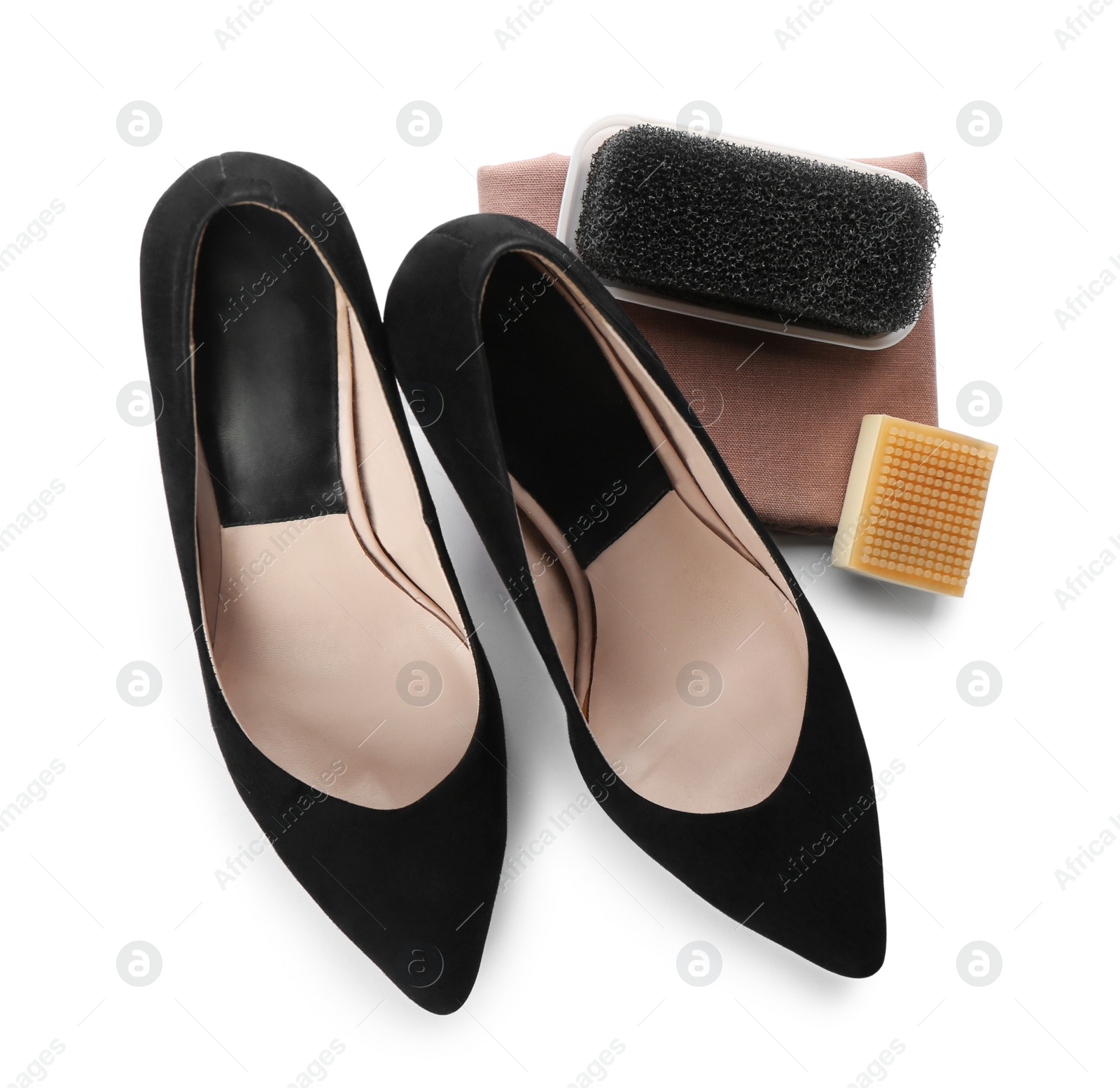 Photo of Stylish footwear and shoe care accessories on white background, top view