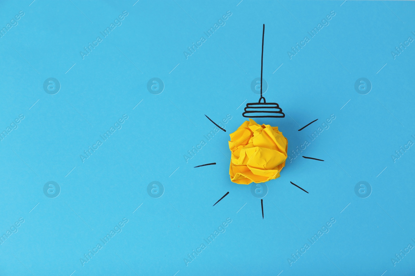 Photo of Composition with crumpled paper ball, drawing of lamp bulb and space for text on color background, top view. Creative concept