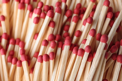 Photo of Pile of wooden matches as background, top view