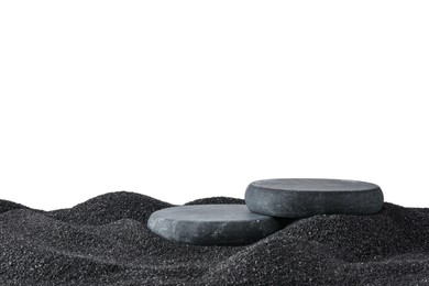 Photo of Presentation of product. Stone podiums on black sand against white background