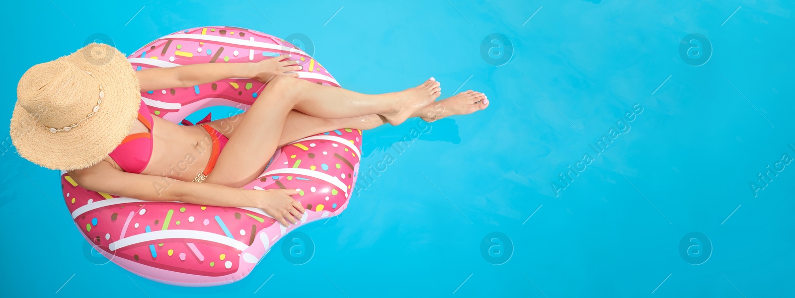 Image of Young woman on inflatable ring in swimming pool, banner design