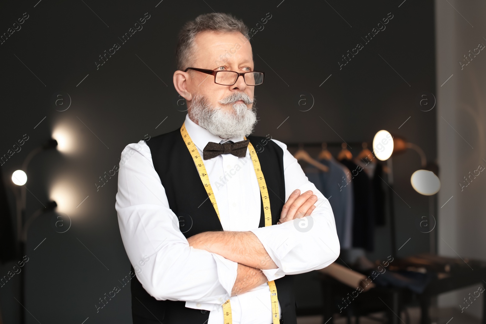 Photo of Portrait of mature tailor in atelier