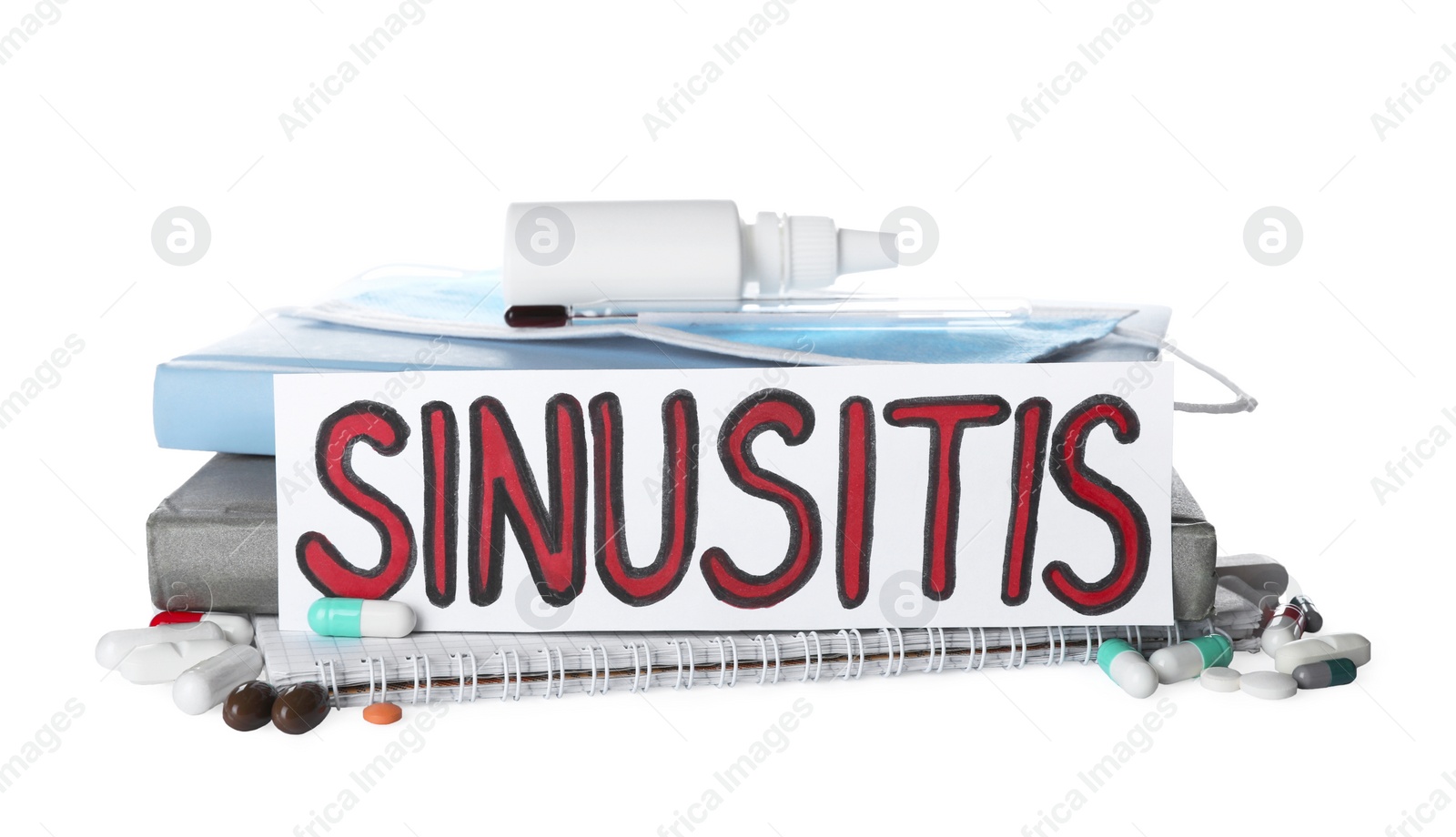 Photo of Card with word SINUSITIS, thermometer, medical mask and different drugs on white background