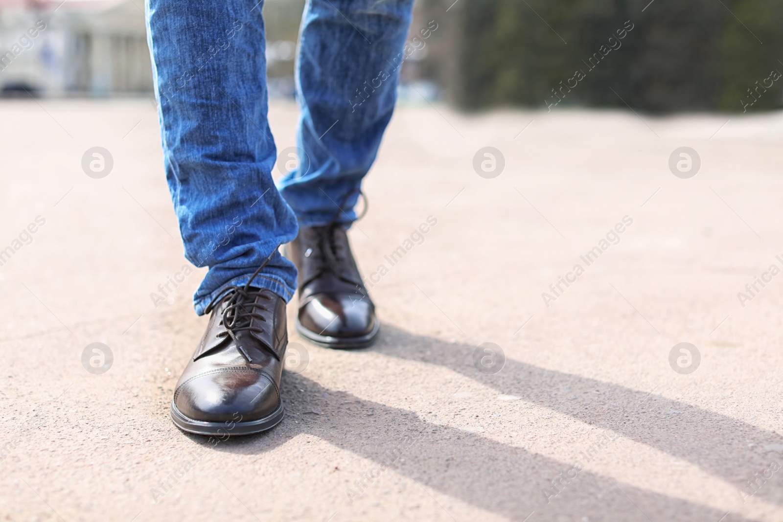 Photo of Man in elegant leather shoes outdoors, closeup