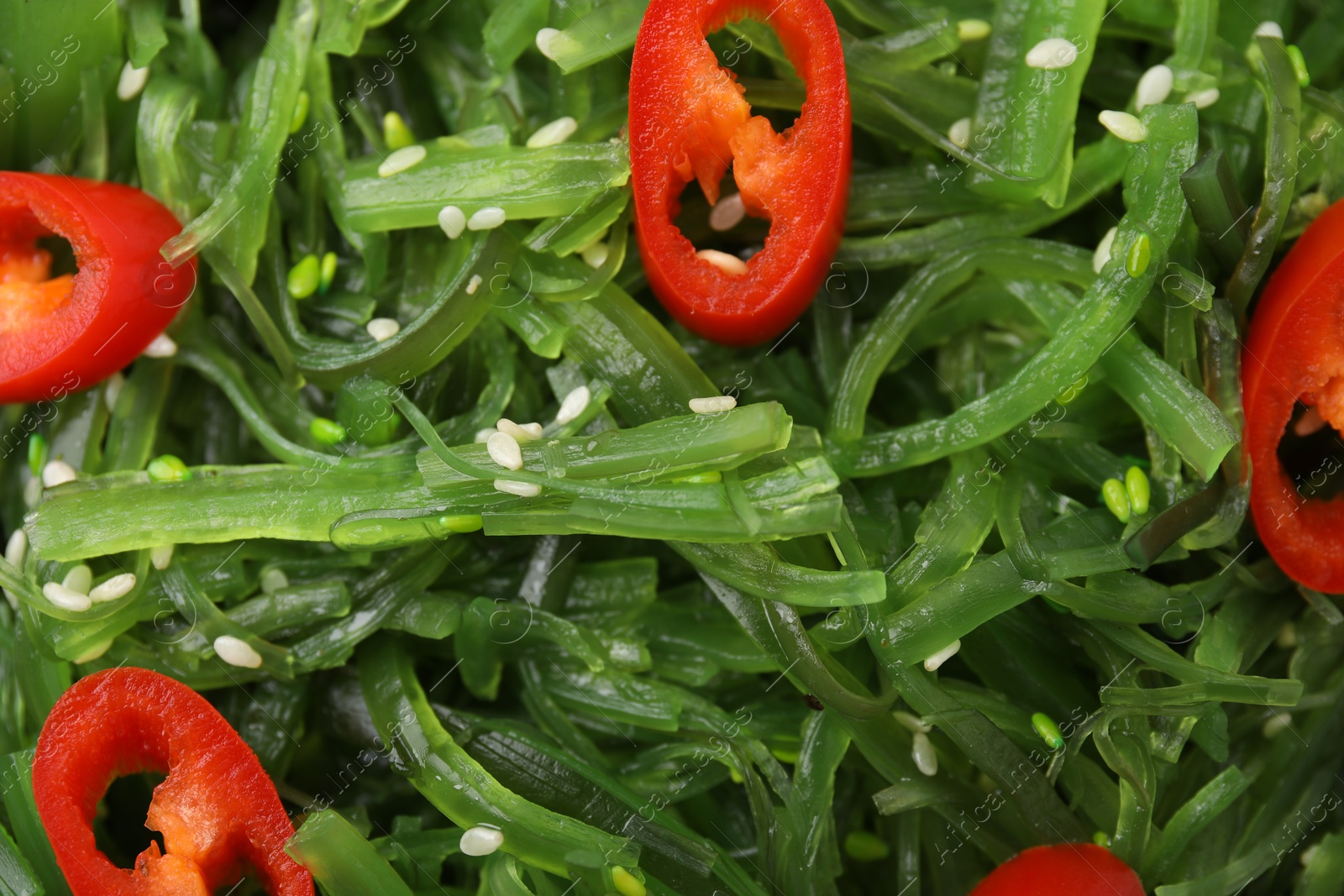 Photo of Tasty seaweed salad as background, top view