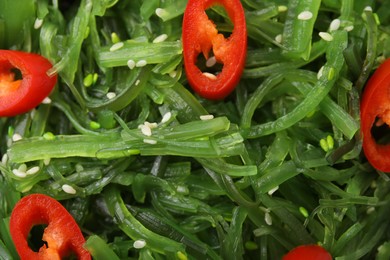 Photo of Tasty seaweed salad as background, top view