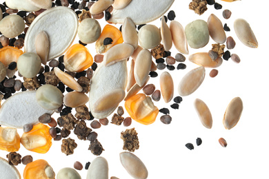 Mix of vegetable seeds on white background, top view