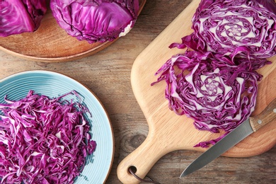 Flat lay composition with red cabbage on wooden table