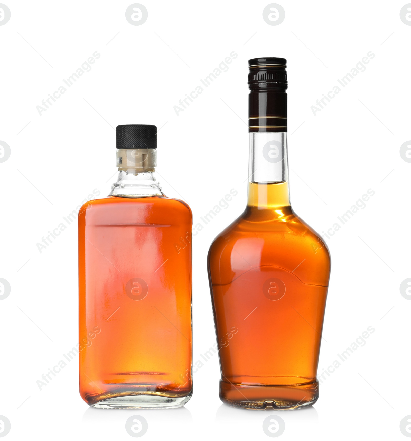 Photo of Bottles of scotch whiskey on white background