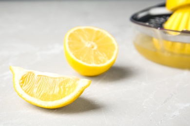 Photo of Slices of ripe lemon on gray table