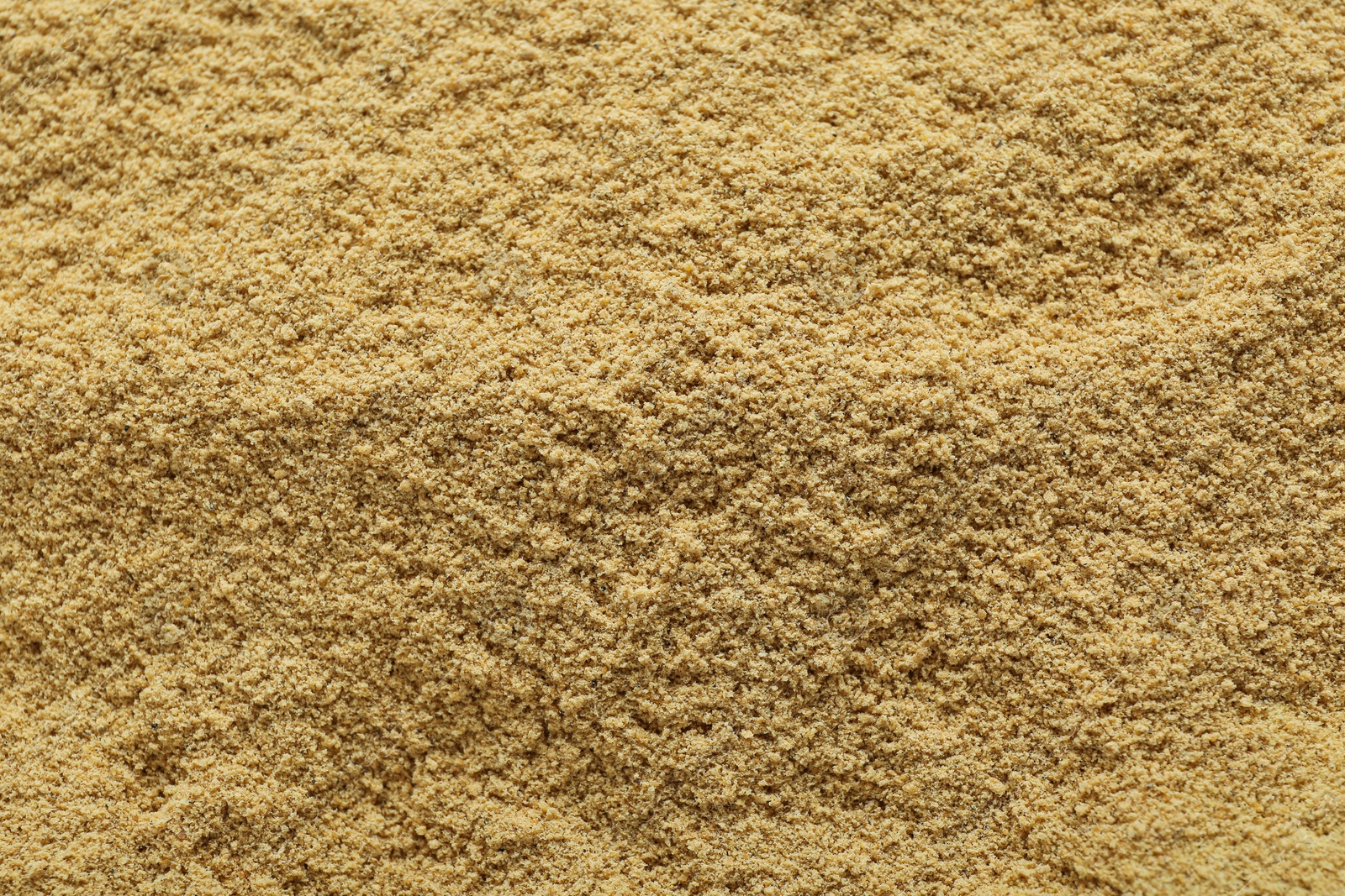 Photo of Aromatic mustard powder as background, top view