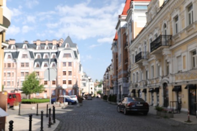 Photo of Blurred view of buildings with beautiful windows in city