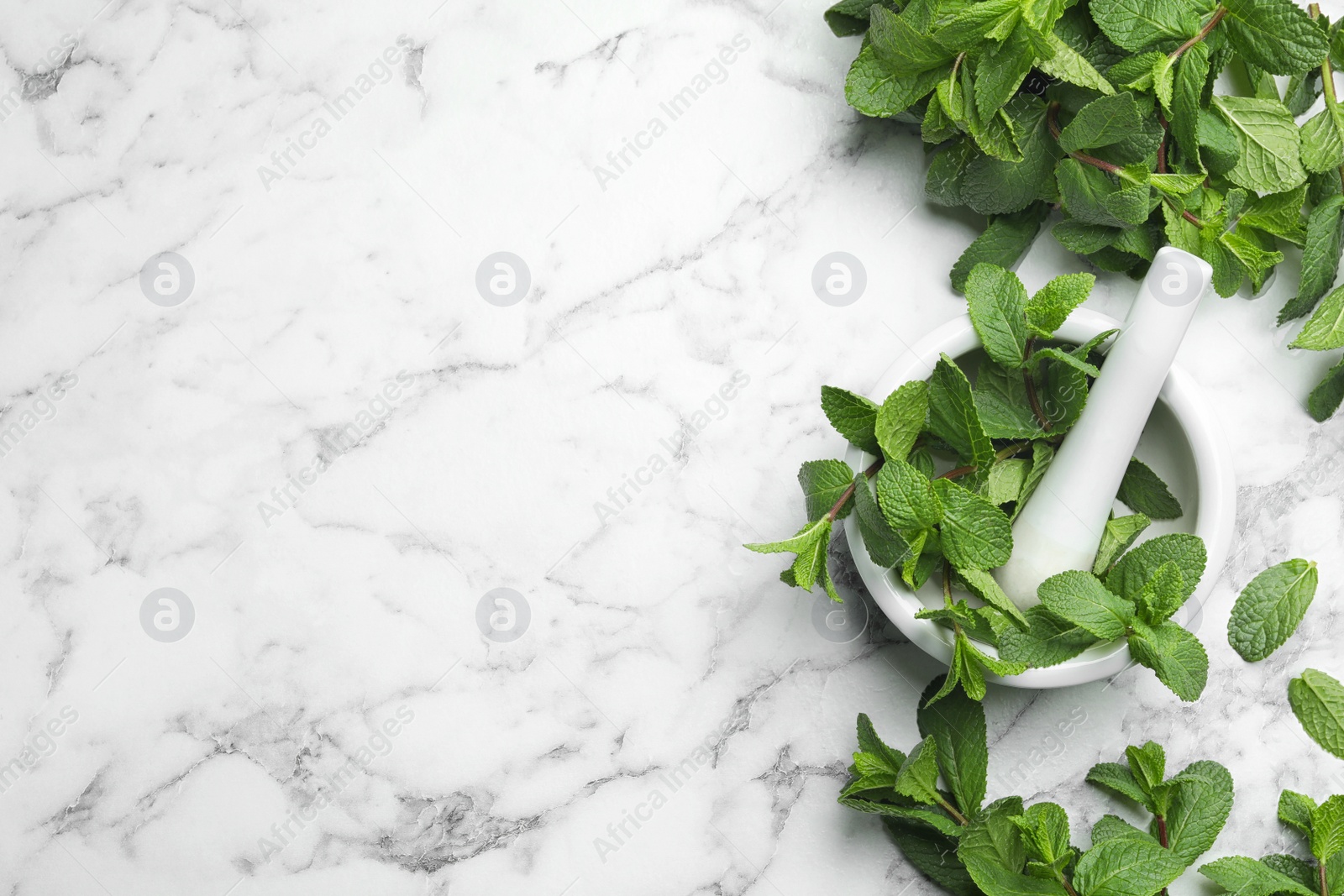 Photo of Flat lay composition with fresh green mint and space for text on marble background