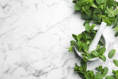 Photo of Flat lay composition with fresh green mint and space for text on marble background