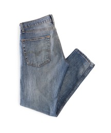 Blue jeans isolated on white, top view. Stylish clothes