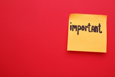 Photo of Paper note with word Important on red background, top view. Space for text