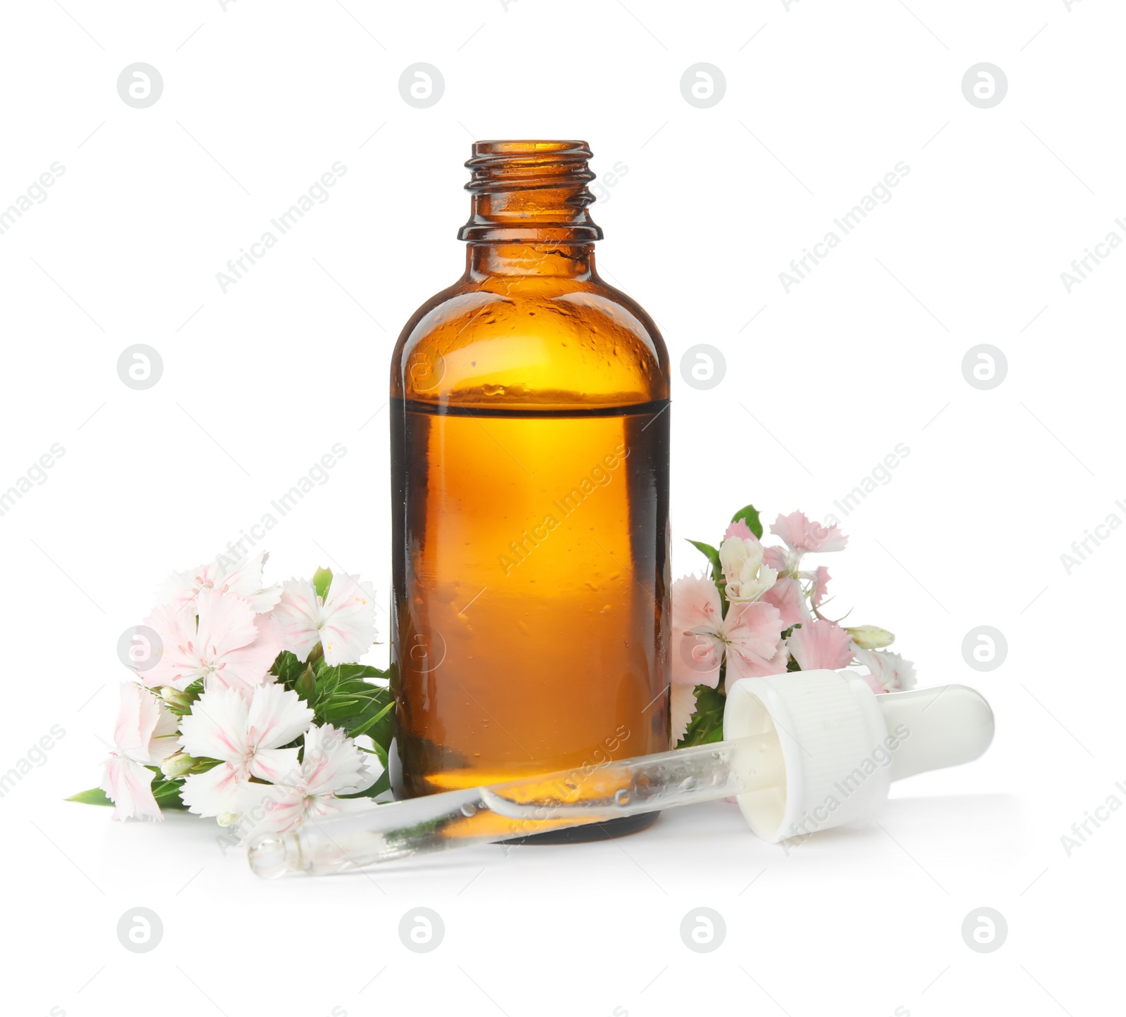 Photo of Bottle of essential oil and flowers on white background