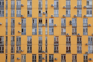 Photo of Colorful modern building with windows. Urban architecture