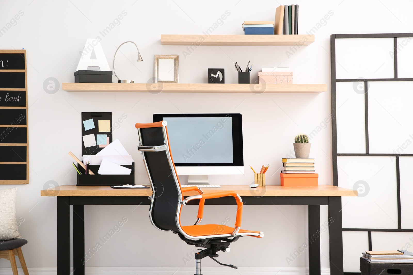 Photo of Modern computer on table in office interior. Stylish workplace