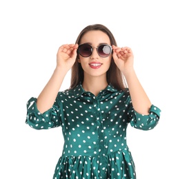 Portrait of beautiful young woman in stylish dress on white background