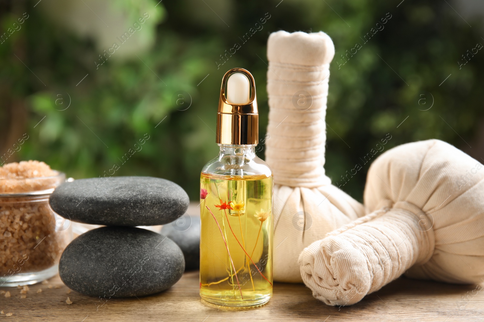 Photo of Composition with spa cosmetic on wooden table, closeup