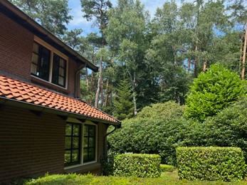 Beautiful view of house and garden on sunny day