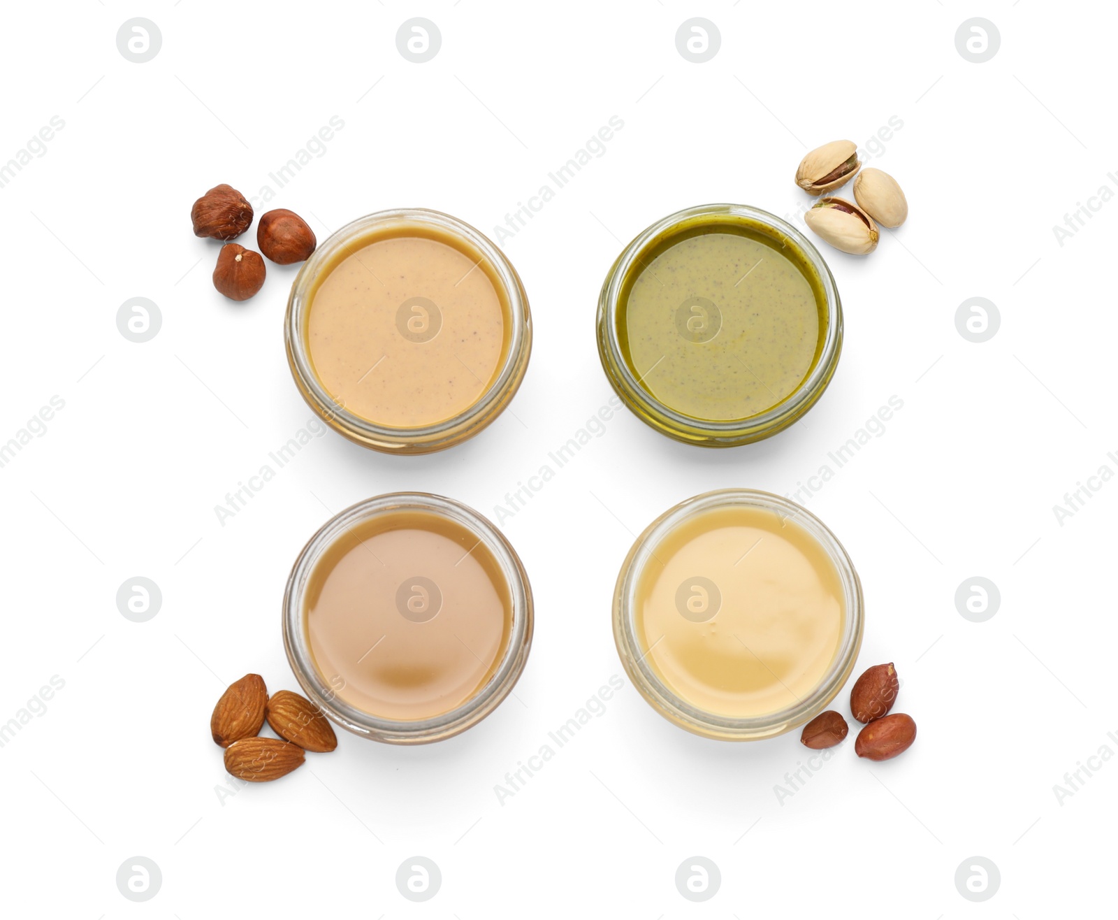 Photo of Different types of delicious nut butters and ingredients on white background, top view