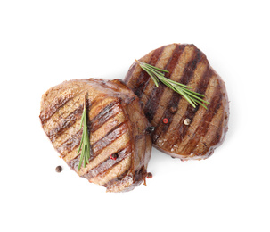 Delicious grilled beef medallions with rosemary and peppers mix isolated on white, top view