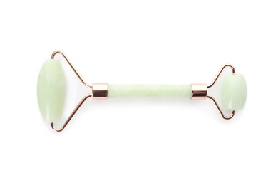 Natural jade face roller on white background