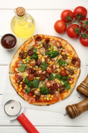 Delicious vegetarian pizza served on white wooden table, flat lay