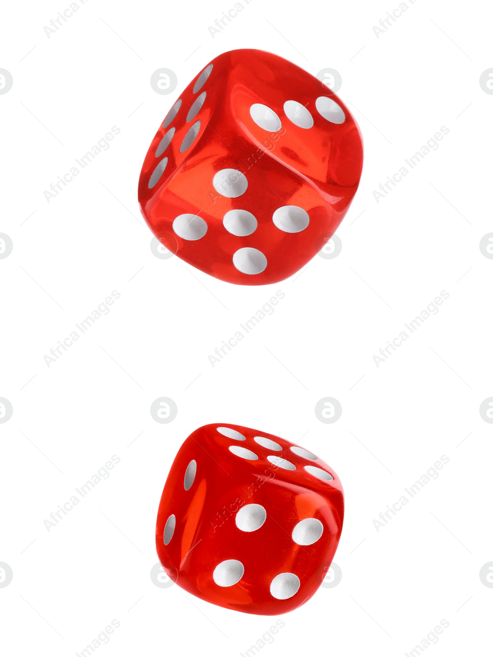 Image of Two red dice in air on white background