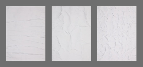Image of Collection of creased blank posters on grey background. Banner design