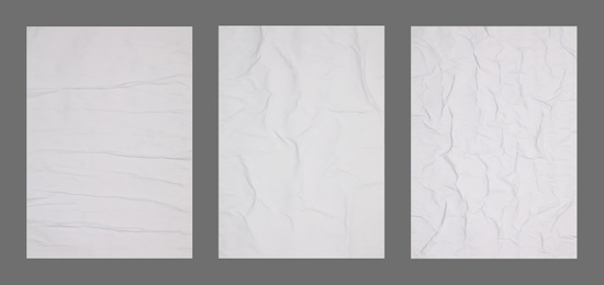 Collection of creased blank posters on grey background. Banner design