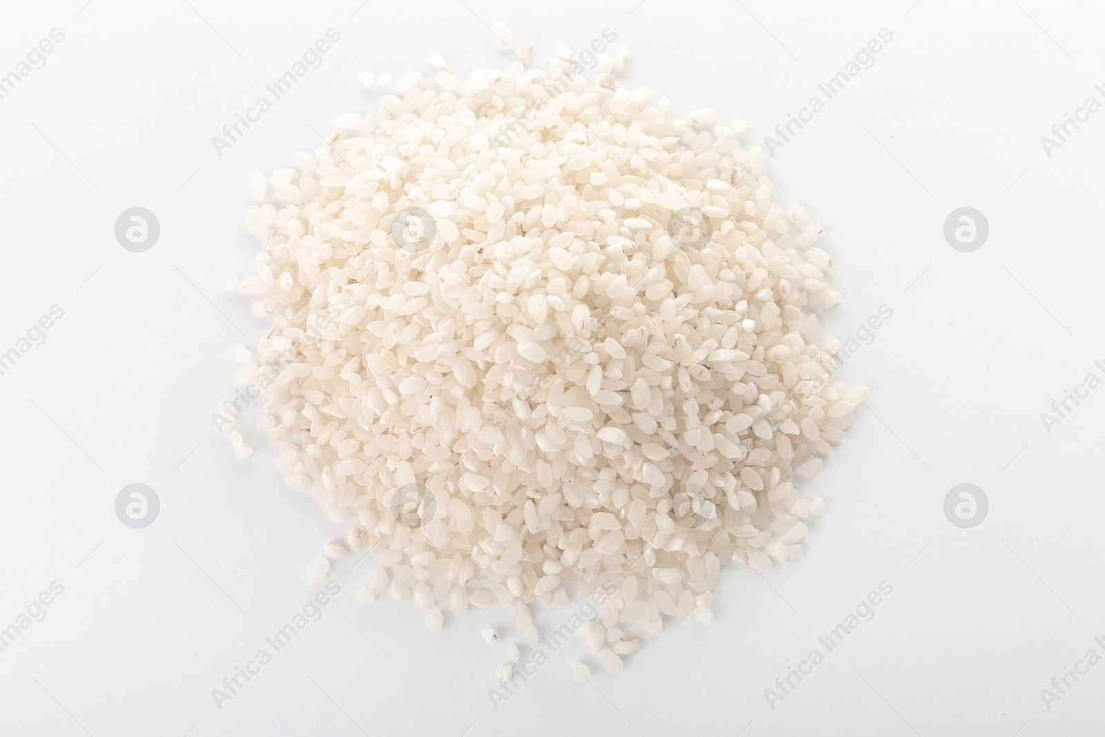 Photo of Raw rice on white background. Healthy grains and cereals