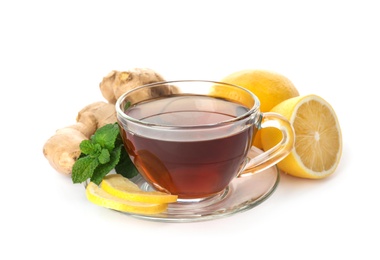 Photo of Cup of tea, ginger, mint and lemons on white background. Cough remedies