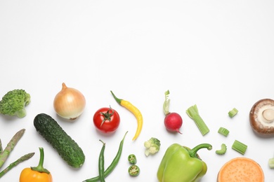 Photo of Flat lay composition with fresh vegetables on white background. Space for text