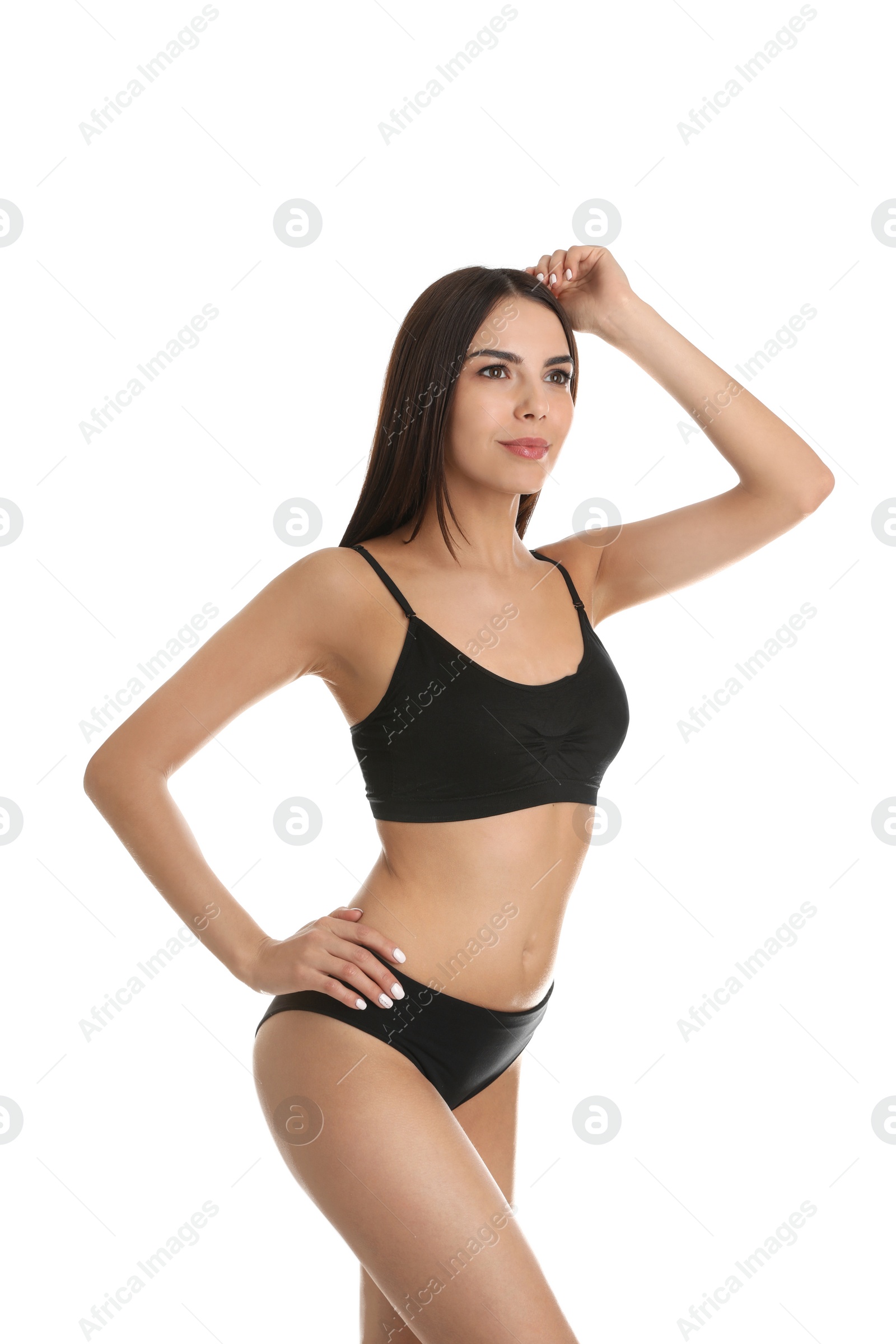 Photo of Portrait of attractive young woman with slim body in underwear on white background