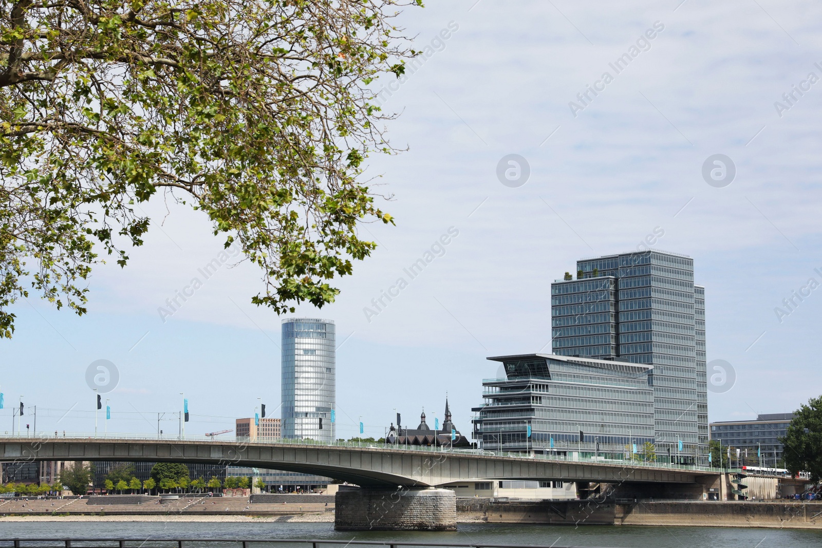 Photo of Picturesque view of modern city architecture and bridge over river