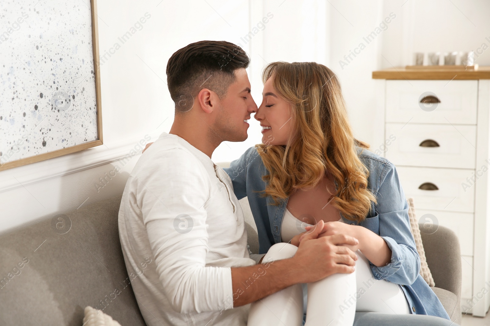 Photo of Lovely couple enjoying time together at home