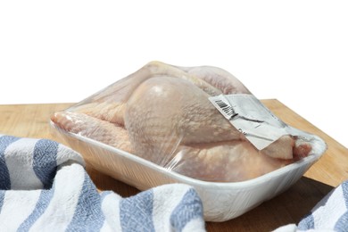 Photo of Fresh raw whole chicken in plastic container and napkin on wooden table